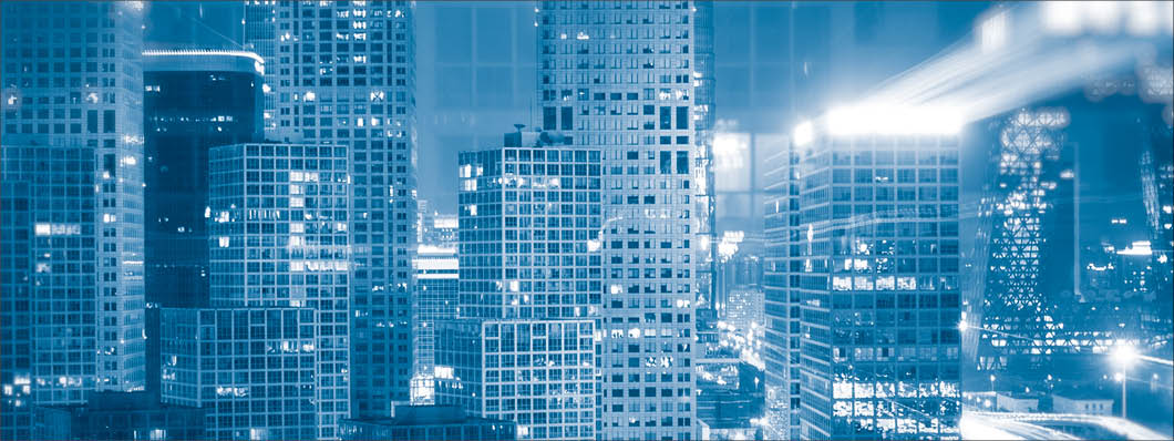 Light trails above buildings at night in China.